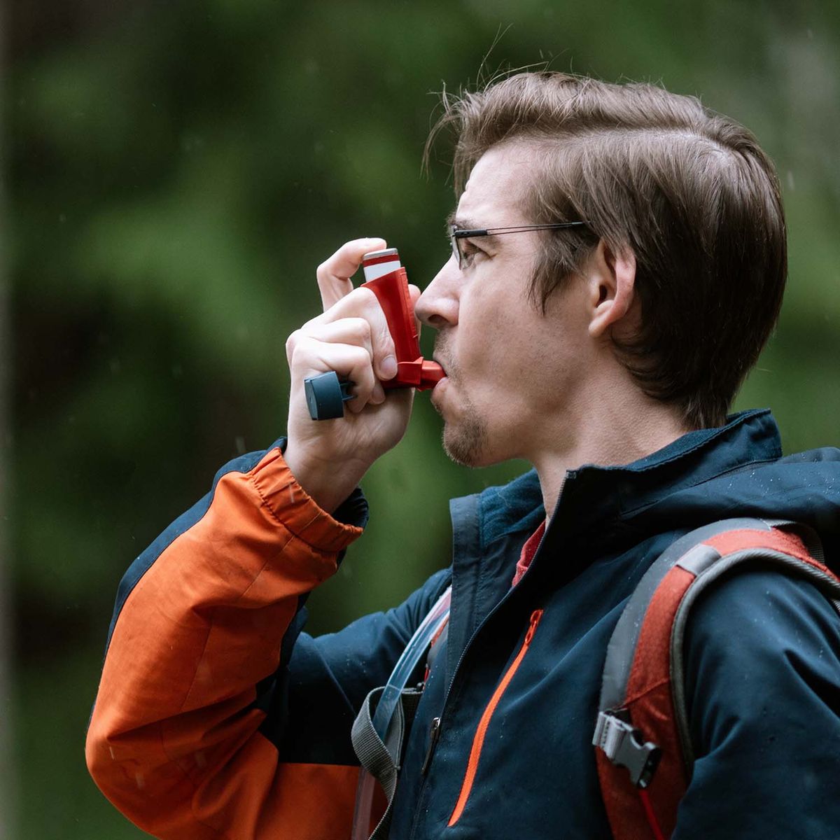 Man using an inhaler