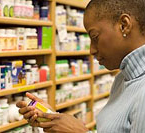 Woman looking at a pill bottle
