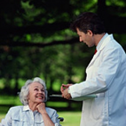 Doctor speaking to elderly woman.