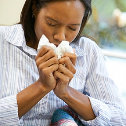 Woman sneezing