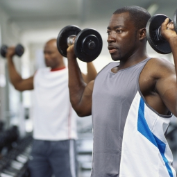 man lifting weights