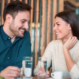 A couple smiling at each other