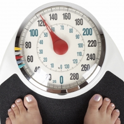 Person standing on a weight scale 