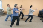 A community group practices Tai Chi