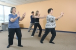 A community group practices Tai Chi