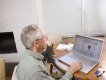 A man reviews a web site on the his laptop computer.