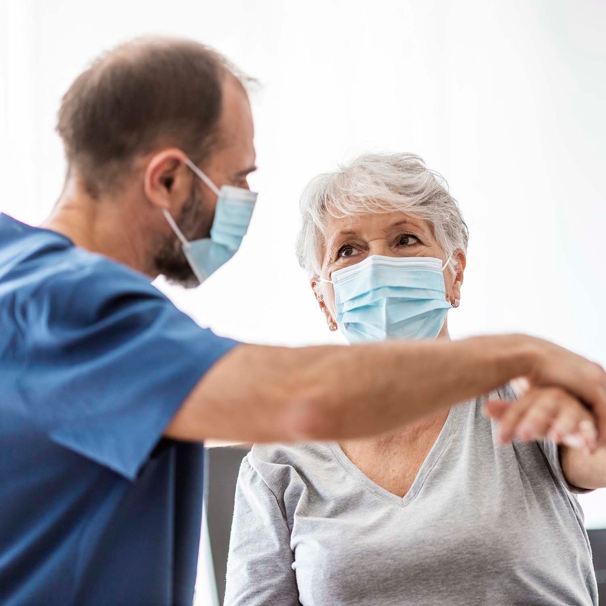 Physician talking to patient in office