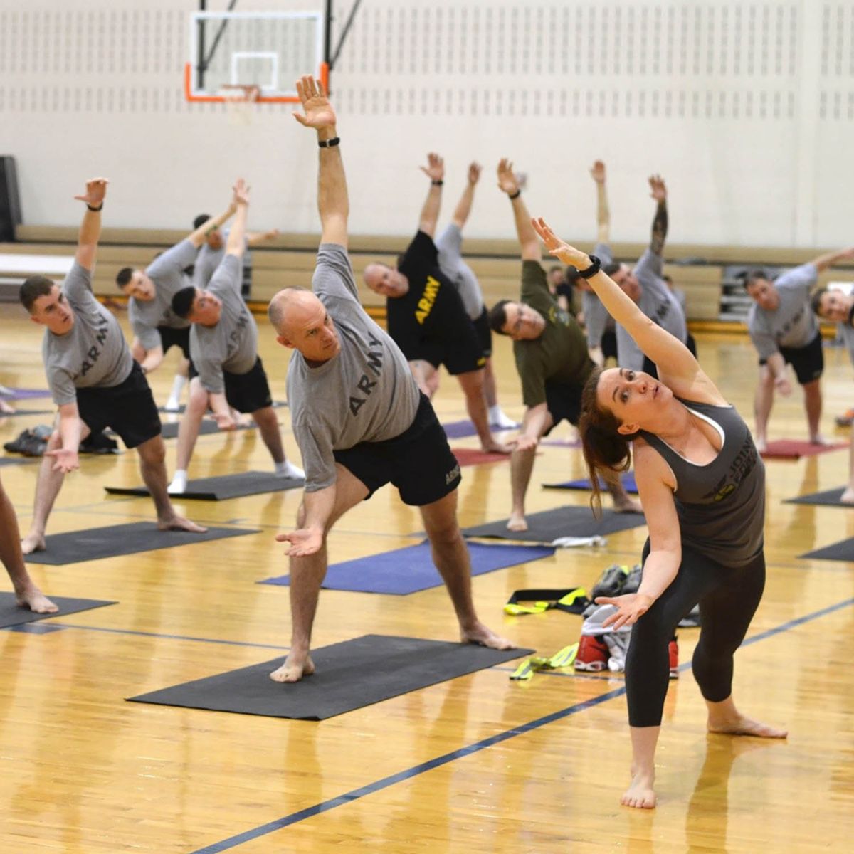 Members of the Army practicing yoga