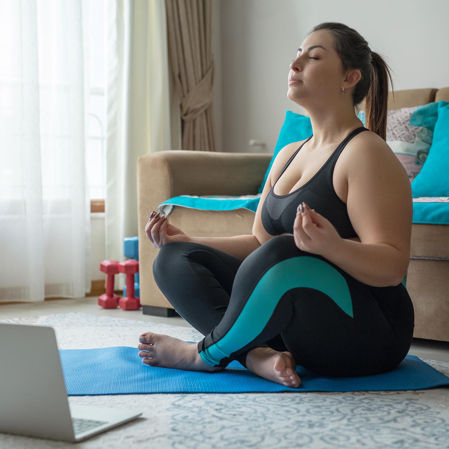 Overweight woman doing a yoga pose